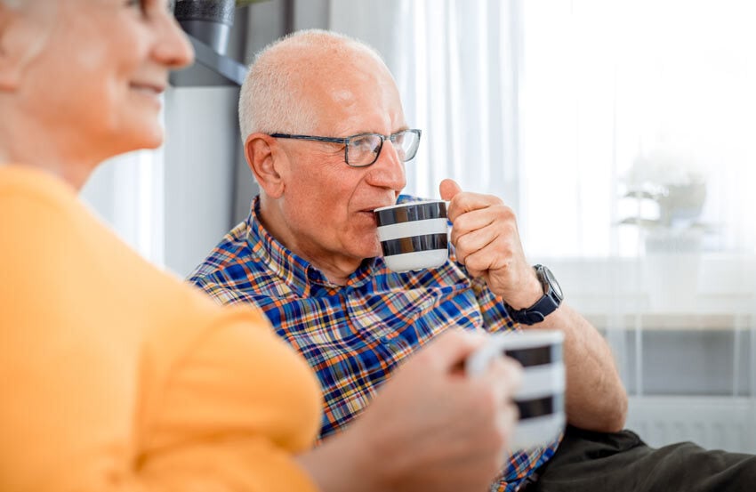 Elderly couple drinking tea