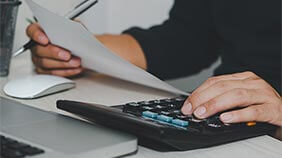 Person calculating their loan repayments