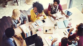 A group of start-up employees sat around a table