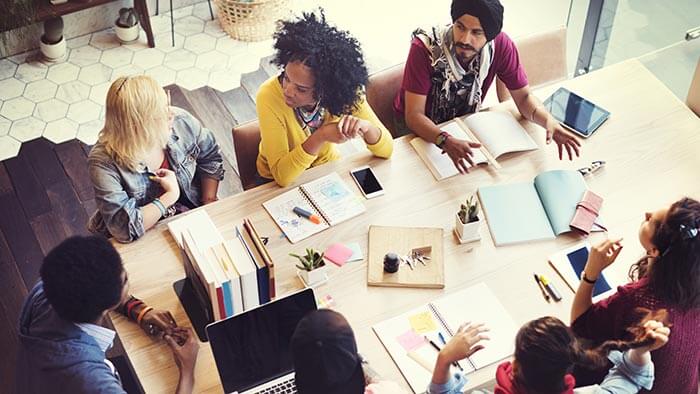 A group of start-up employees sat around a table