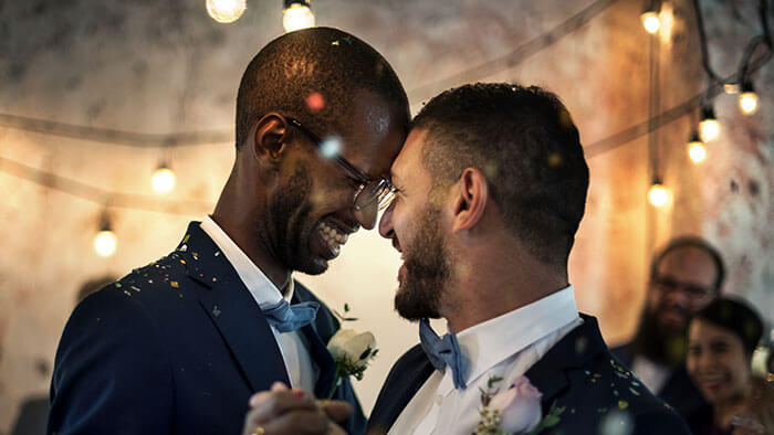 Two grooms dancing on their wedding day