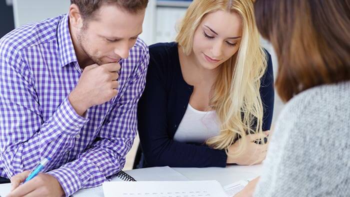 Couple looking at a mortgage offer