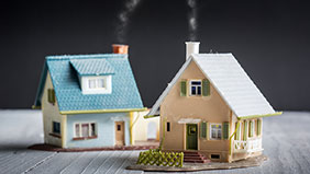 Two model houses sat on a tabletop