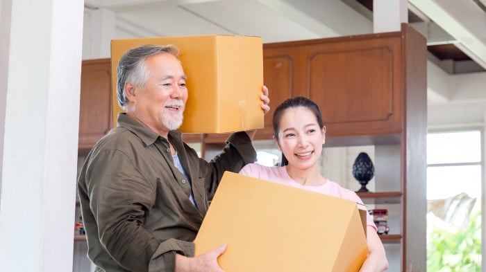 Parent helping their child move