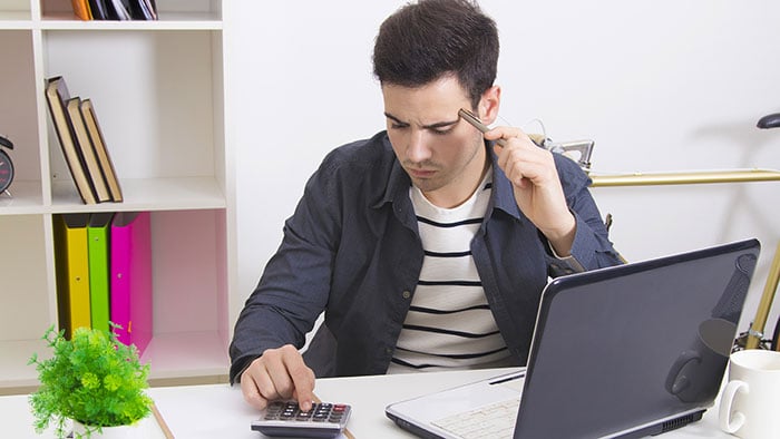 Self-employed man working out mortgage options