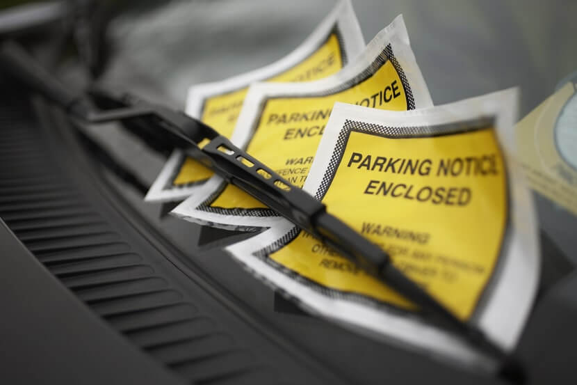 Parking notices on a car windscreen