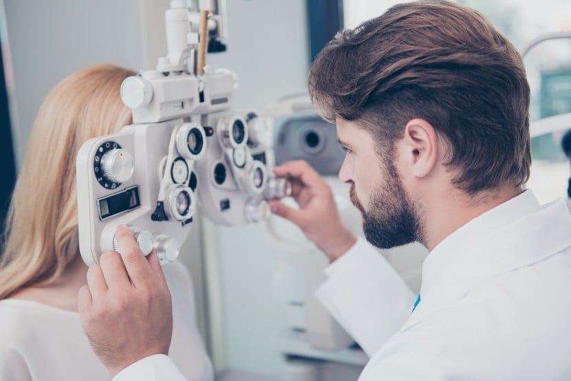 Person conducting eye test