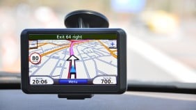 Sat nav being used attached to car windscreen