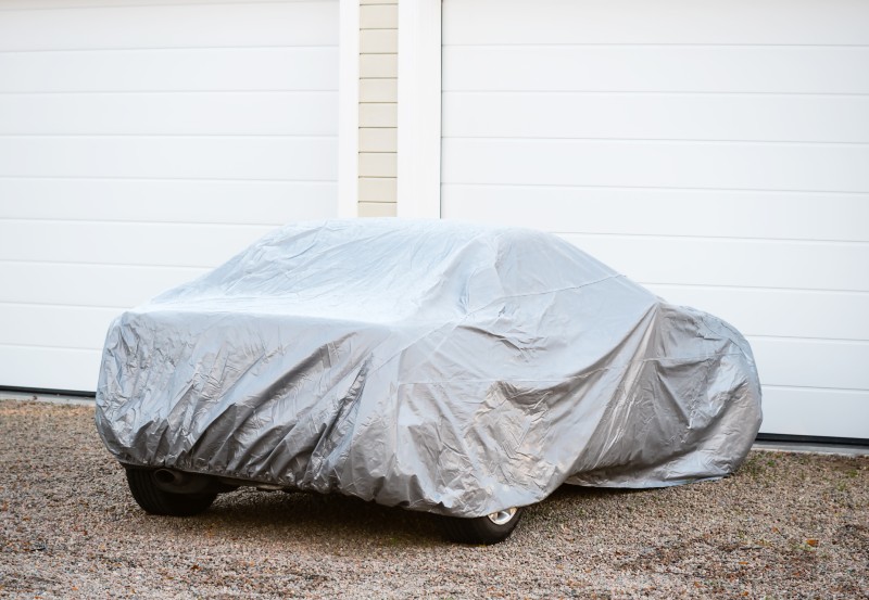 A car covered with a sheet
