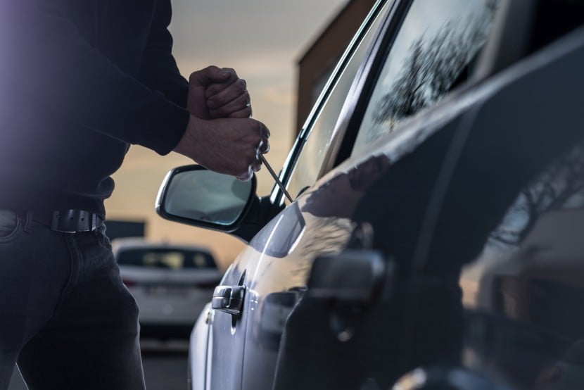 Person breaking into a car