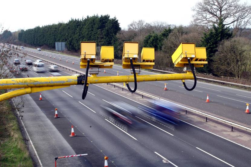 Yellow speed cameras on a motorway