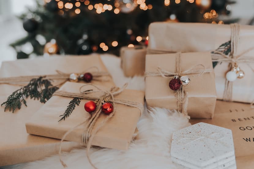 Christmas presents wrapped in brown paper and string