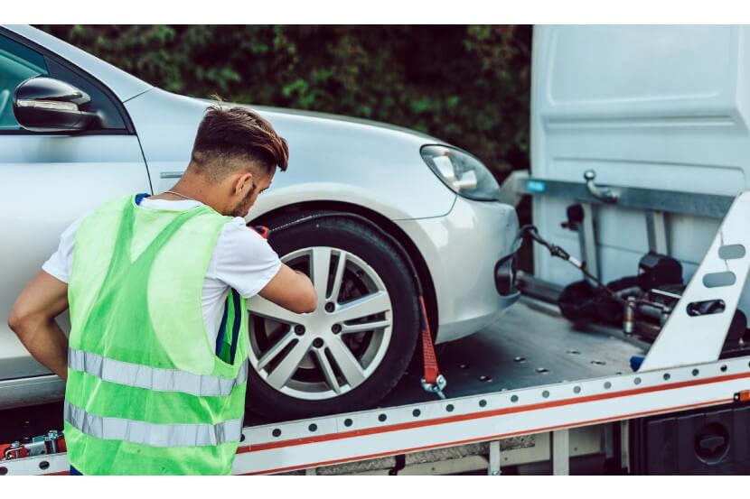 Someone seizing a silver car
