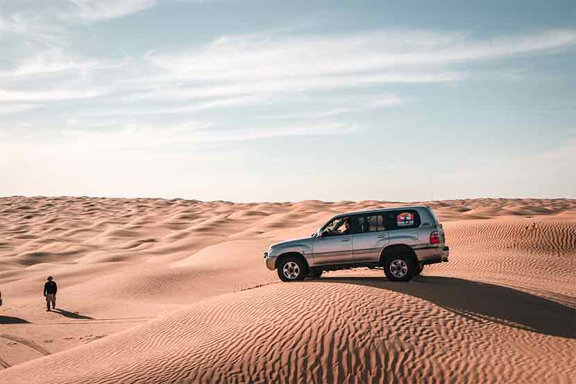 Toyota Land Cruiser in the sand dunes of the Sahara Desert