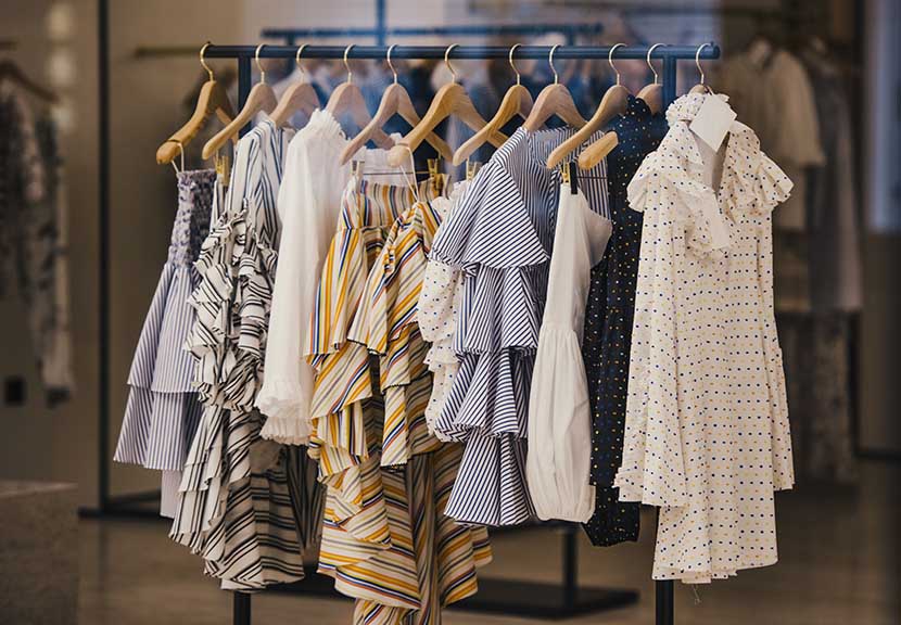 A rail of fashionable designer dresses, tops and skirts 