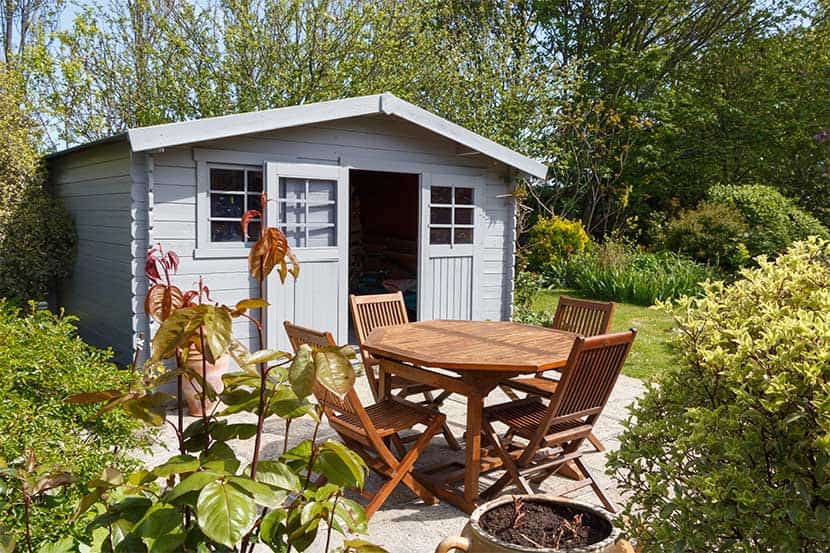 Shed with patio furniture outside