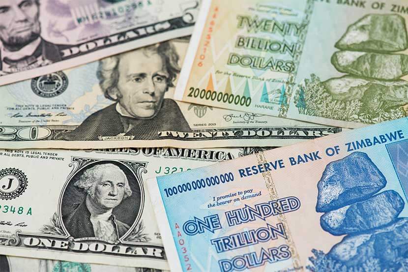 US dollar and Zimbabwe 100 trillion dollar bill