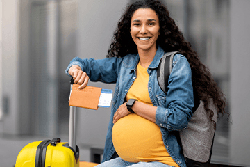 Pregnant woman travelling at the airport