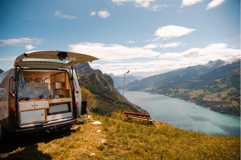 A campervan overlooking a lake 