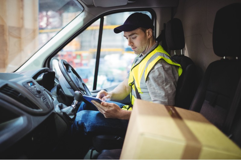 A van driver checks their parcels