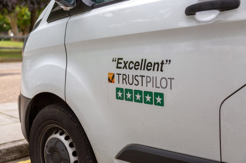 White van with trustpilot rating signwritten on the door