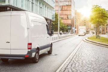 A van parked up on a street