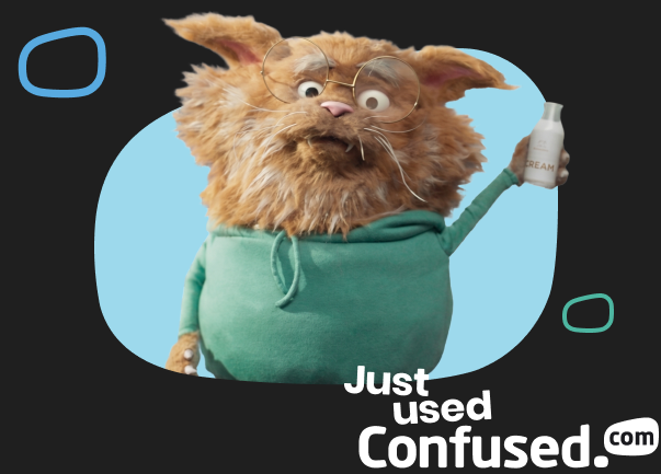 Furry orange creature with glasses and rabbit ears wearing a green hoodie, holding a cream bottle, "Just used Confused.com"