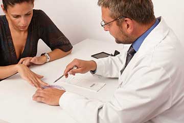 A consultant going through paperwork with someone