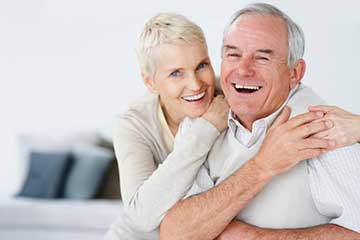An older couple embracing