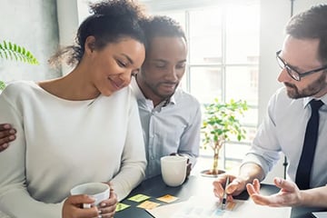 Couple speaking to mortgage advisor