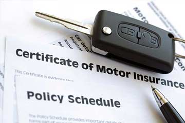 an insurance certificate and key