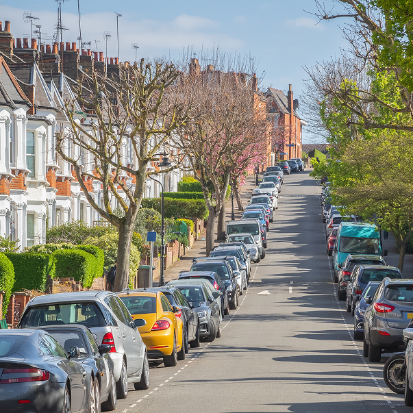 A street with parked cars