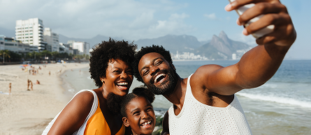 Family on a beach taking a selfie