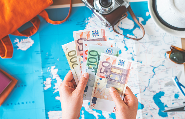 Hand counting euros for travelling