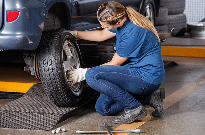 Mechanic servicing a car