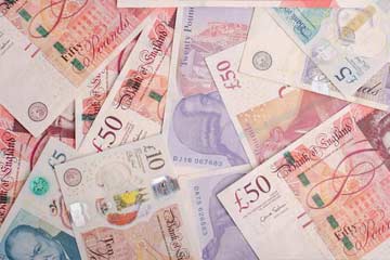 a pile of UK banknotes